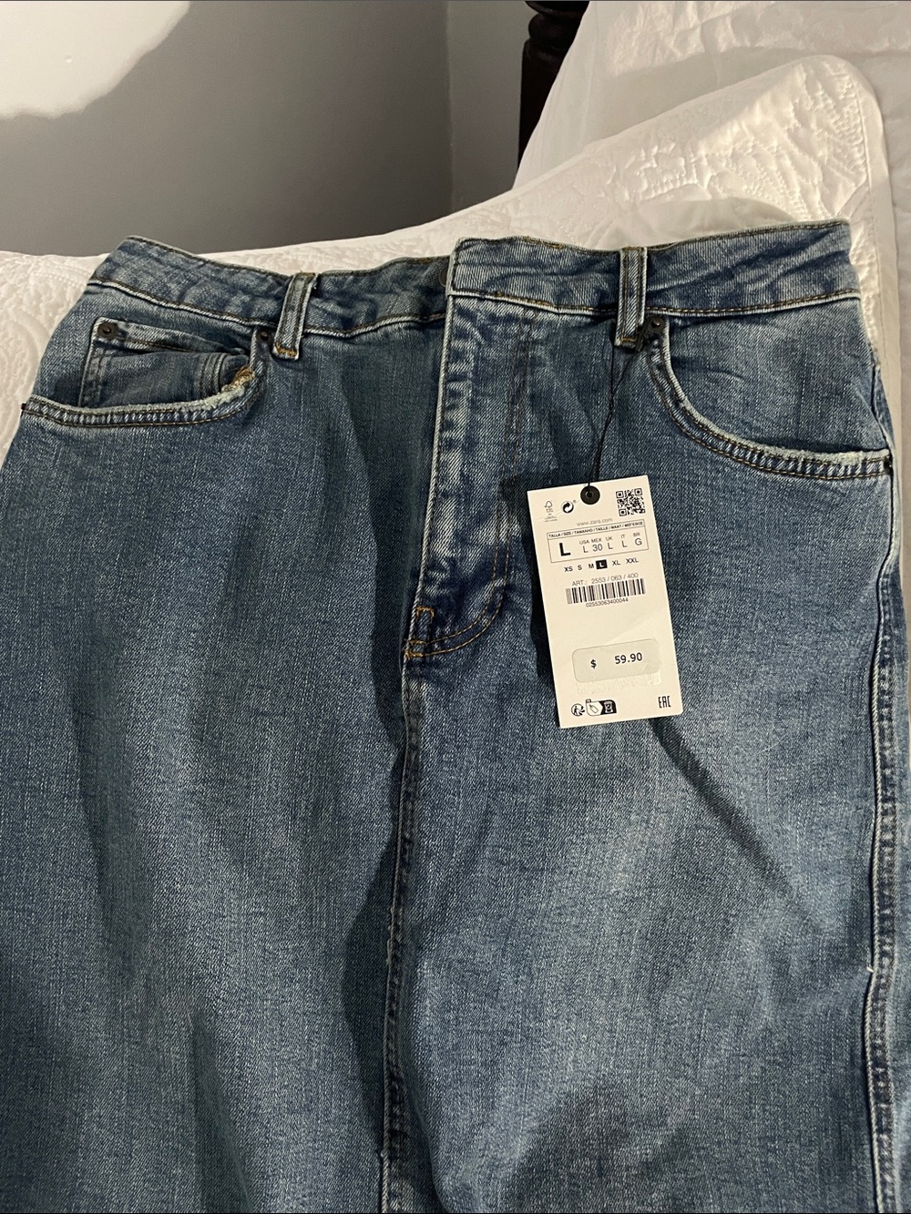 Woman’s Zara maxi denim skirt with a slight stretch.
